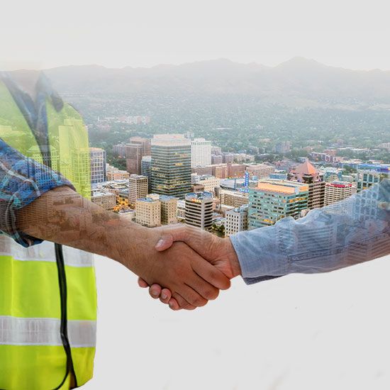 Hands shaking over aerial view of Salt Lake City